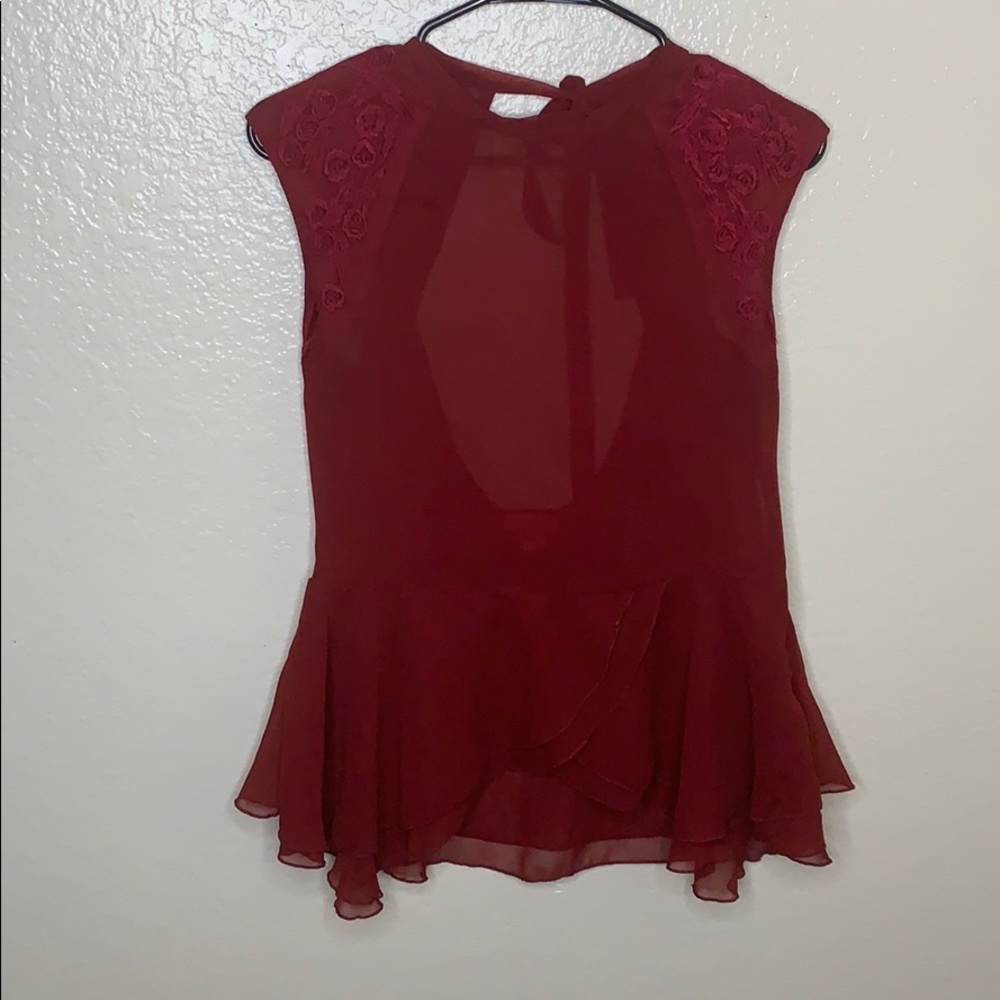 Red blouse with lace accents